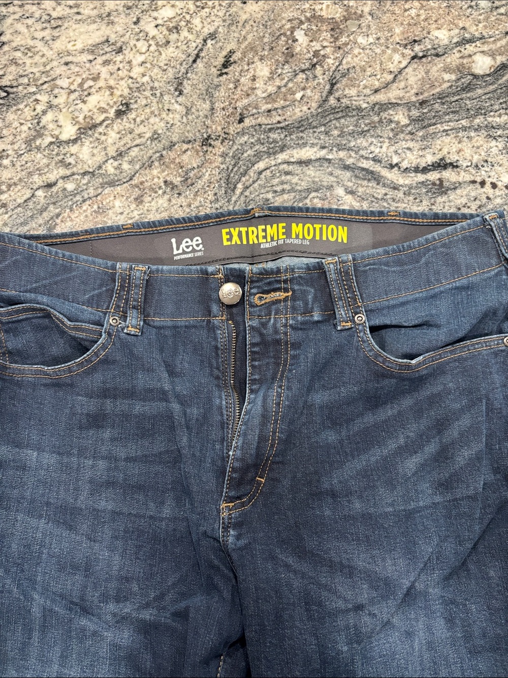 Lee Extreme Motion Jeans in dark blue with yellow logo

36x30 or 32x30